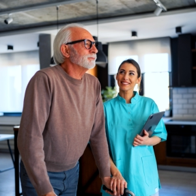 nurse assisting the elderly