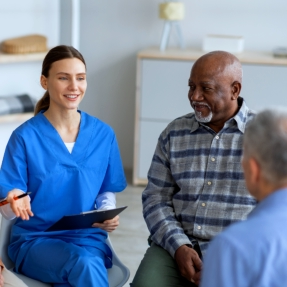 caregiver talking to the elderly