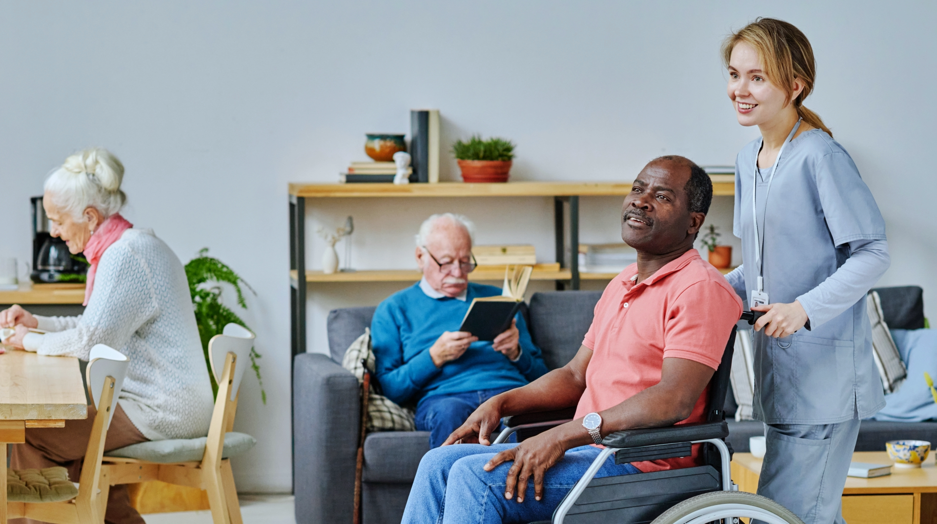 caregiver pushing the elderly man